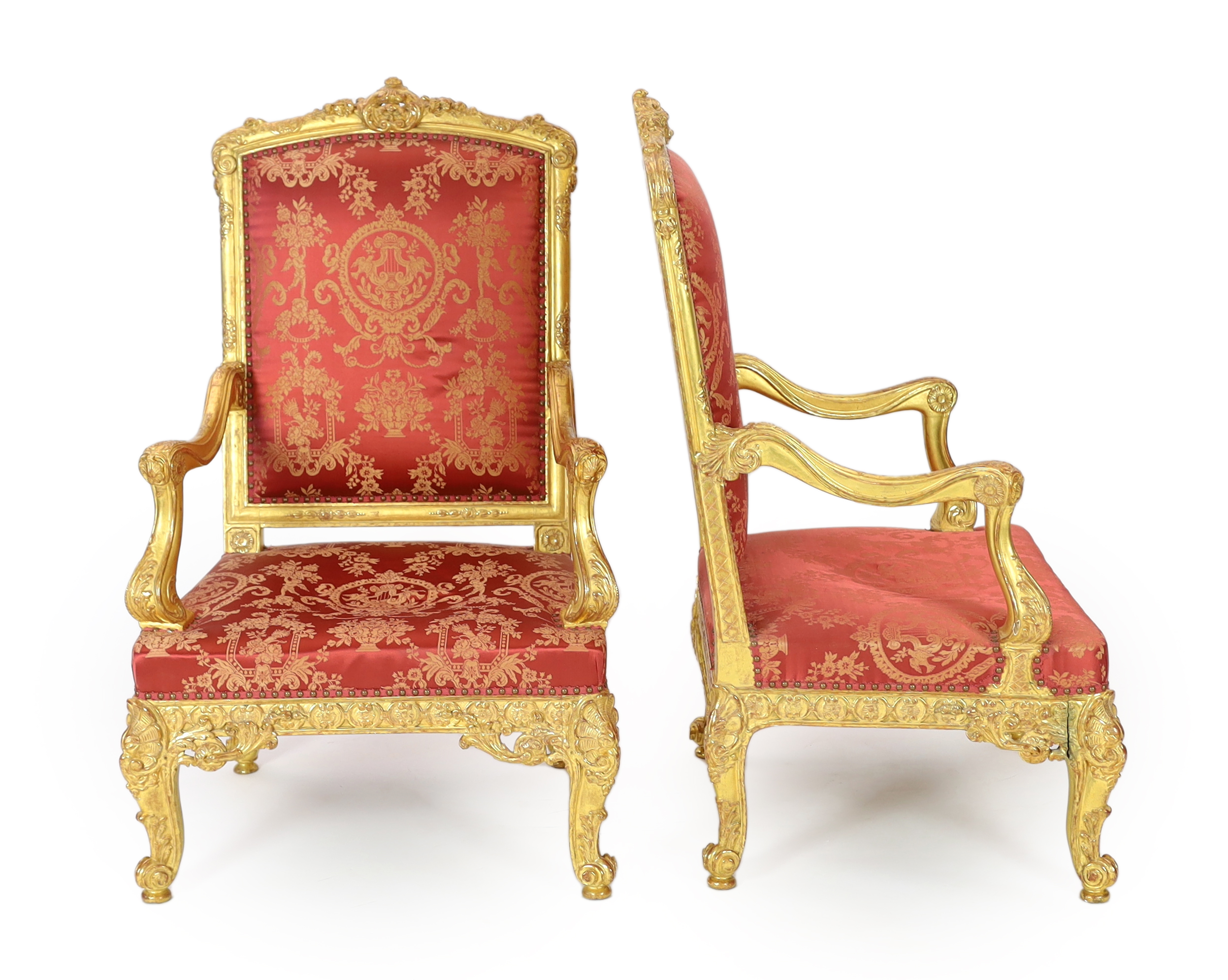 A pair of Louis XV style carved giltwood fauteuils Please note this lot attracts an additional import tax of 5% on the hammer price